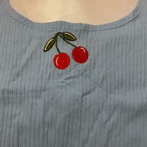 Blue top with ruffles at the bottom